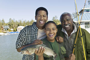 Photo of family with fish at lake, CA